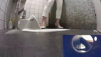 beautiful women peeing in the toilet